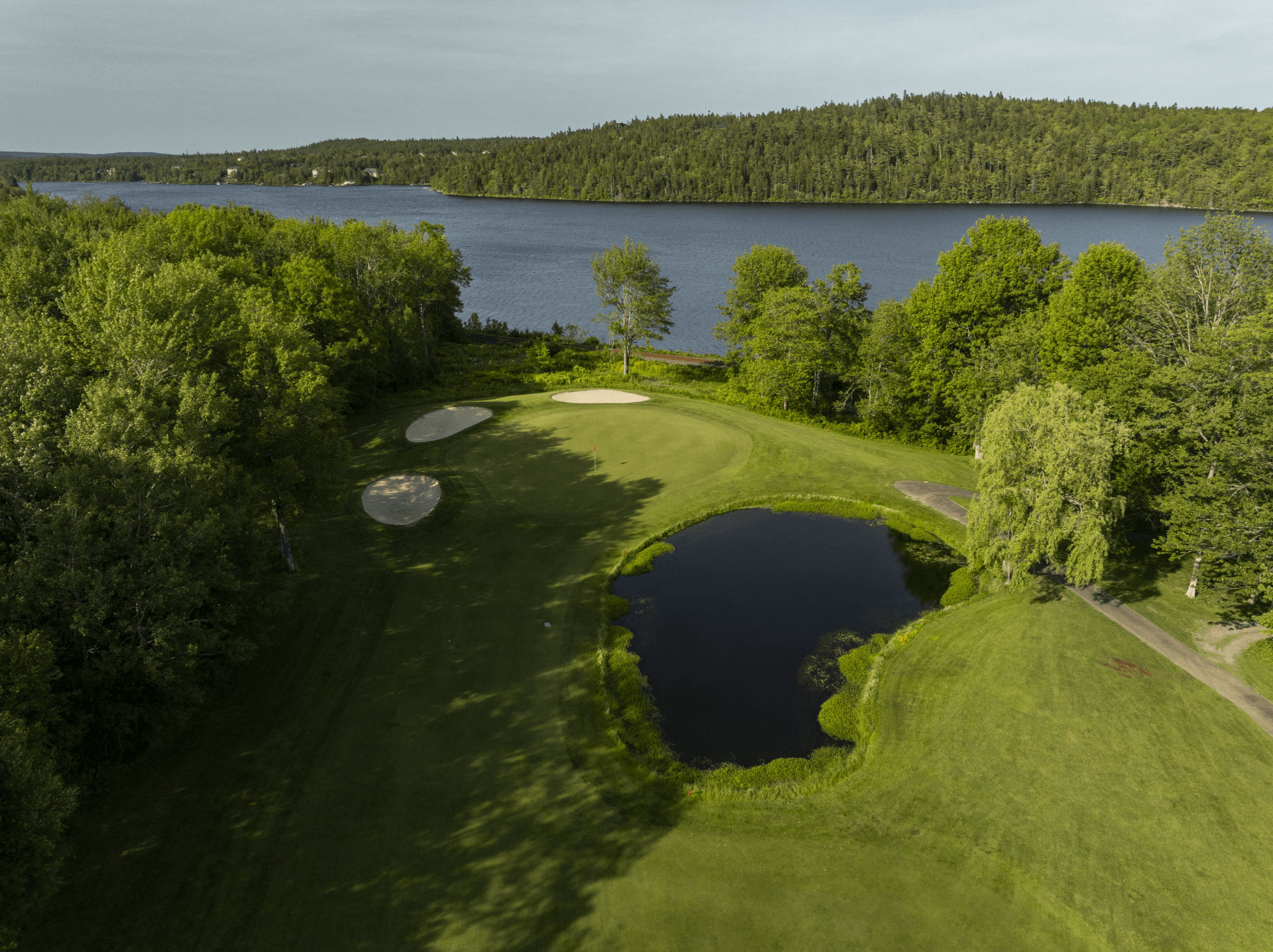 New-Course---14-Green-2025_A-golf-course-near-a-large-lake-Ashburn-GC